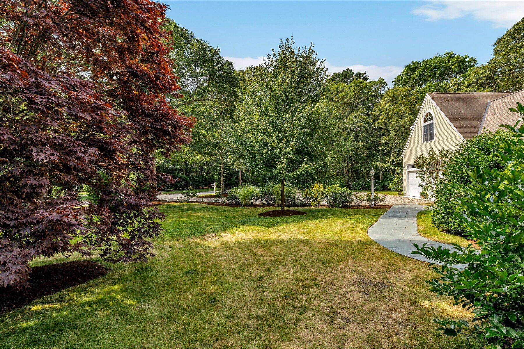 663 Crowells Bog Road Brewster, MA 02631 - Photo 32 of 46 a view of a house with a yard