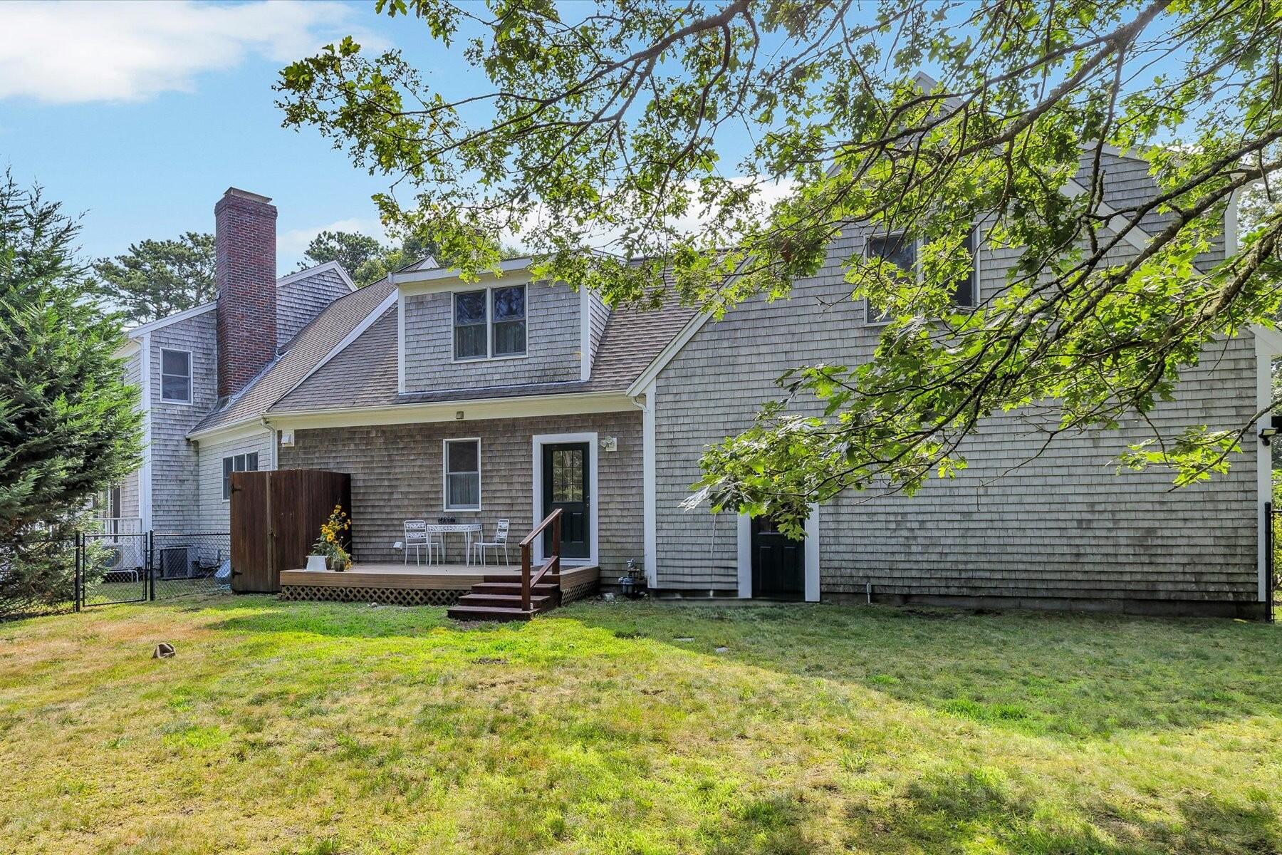 663 Crowells Bog Road Brewster, MA 02631 - Photo 38 of 46 a front view of a house with garden