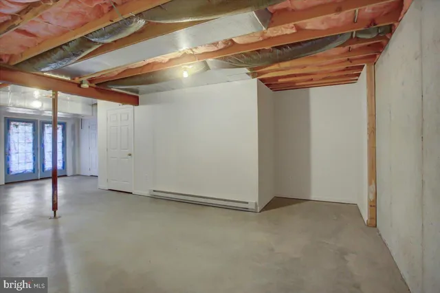 a view of a room with wooden walls