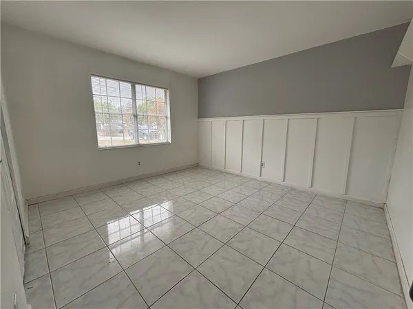 a view of an empty room and window