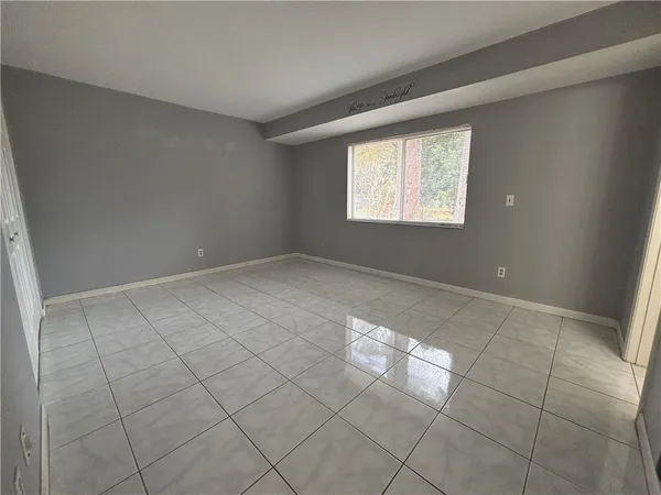 a view of an empty room and window