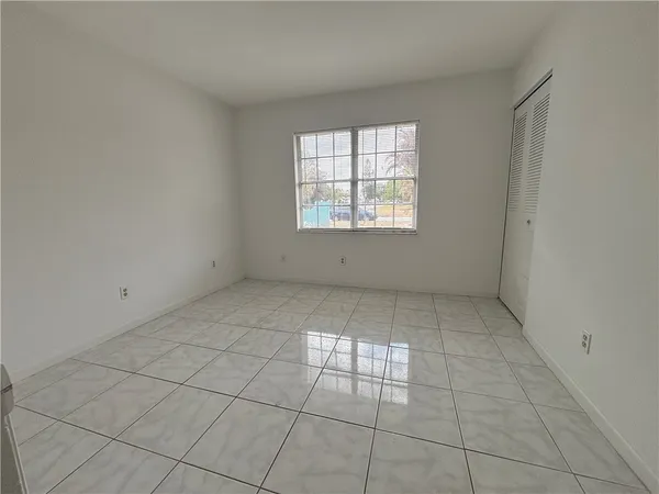 an empty room with a white door