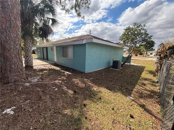 a view of a house with a yard and garage
