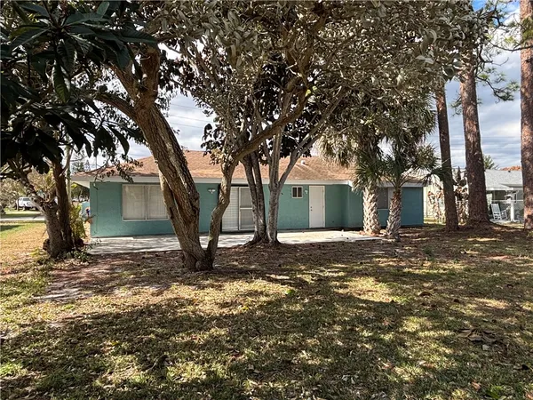 a view of a house with a tree