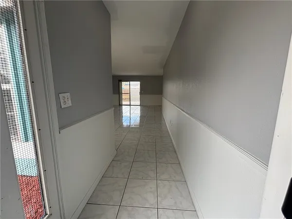 a view of hallway with windows