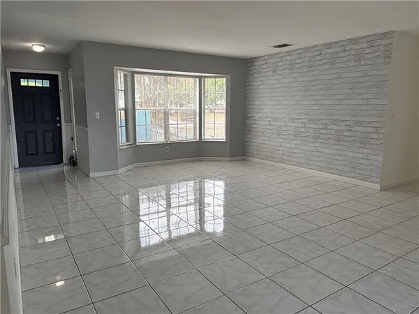 a view of an empty room and window