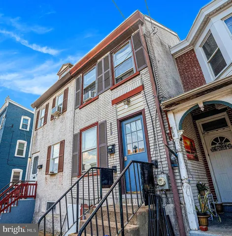 a view of a building with a roof deck