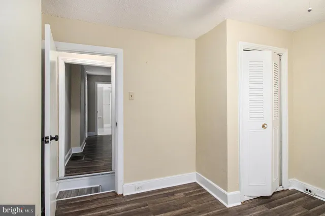 a view of a bedroom from a hallway