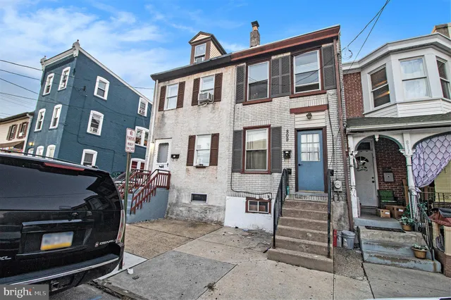 a front view of a building with glass windows