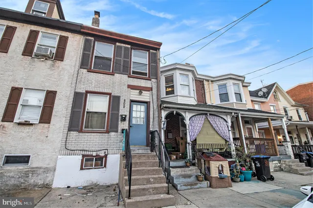 a front view of a building with large windows