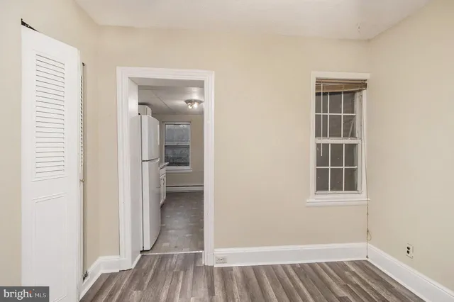 an entryway of a room and wooden floor
