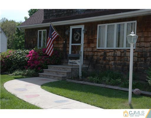 15 Channing Road East Brunswick, NJ 08816 - Photo 1 of 10 a front view of a house with a yard