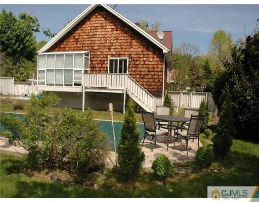15 Channing Road East Brunswick, NJ 08816 - Photo 2 of 10 a view of a house with backyard and sitting area