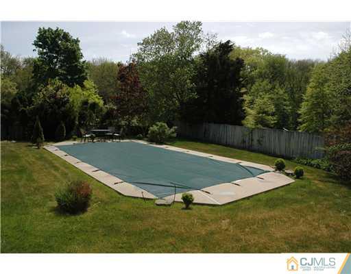 15 Channing Road East Brunswick, NJ 08816 - Photo 3 of 10 a view of a tennis court