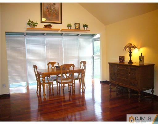 15 Channing Road East Brunswick, NJ 08816 - Photo 5 of 10 a view of a dining room with furniture and wooden floor
