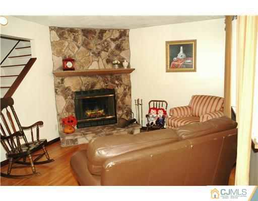 15 Channing Road East Brunswick, NJ 08816 - Photo 6 of 10 a living room with furniture and a fireplace