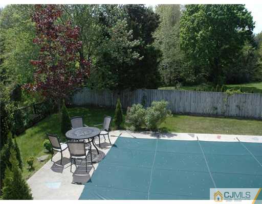 15 Channing Road East Brunswick, NJ 08816 - Photo 8 of 10 a view of a backyard with sitting area