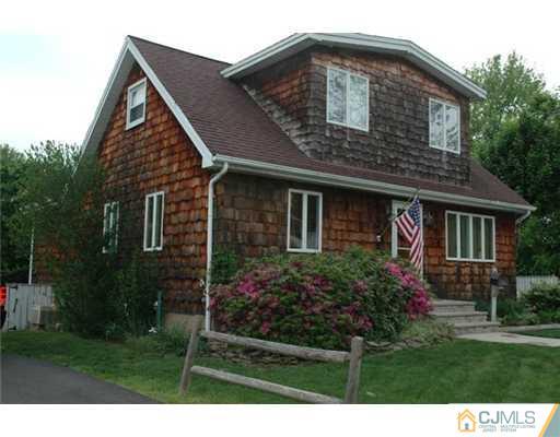 15 Channing Road East Brunswick, NJ 08816 - Photo 9 of 10 a front view of a house with a yard