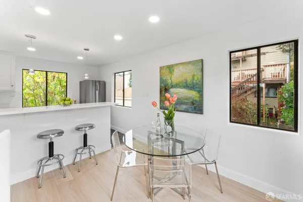 a view of a dining room with furniture window and outside view