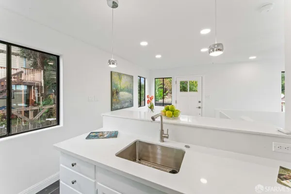 a kitchen with a sink and a window