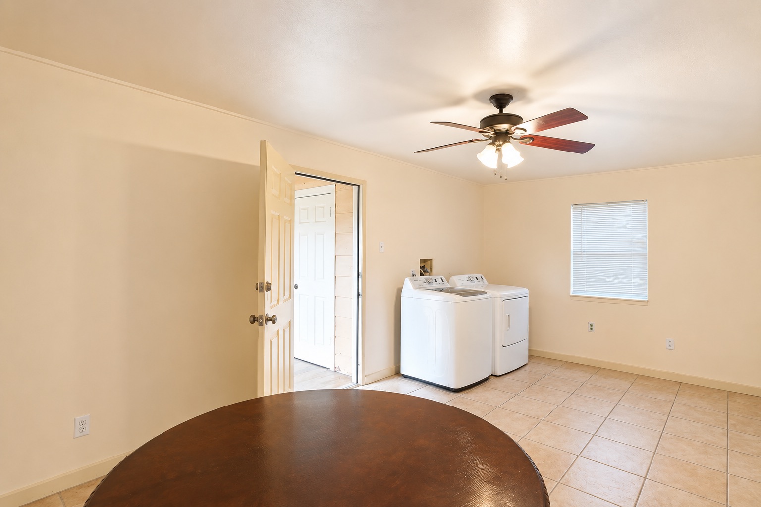 1508 Walnut Street Georgetown, TX 78626 - Photo 30 of 37 Functional laundry room featuring a ceiling fan and durable tile flooring for everyday convenience.
