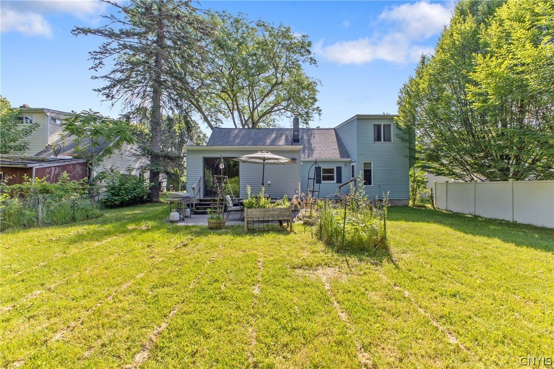125 Circle Road Salina, NY 13212 - Photo 33 of 39 Nice size backyard, fully fenced in with several garden beds and a patio space, great for entertaining!