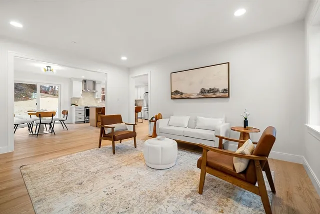 a living room with furniture and a table