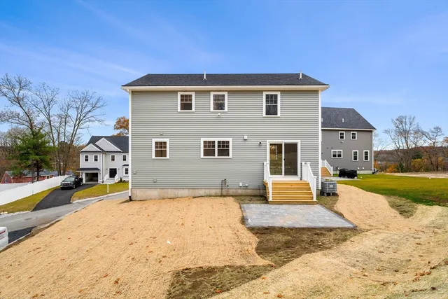 a view of a house with swimming pool and sitting area