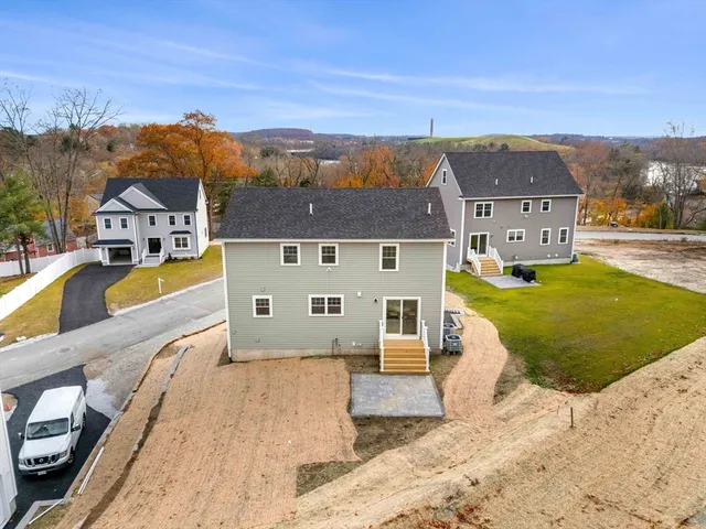 an aerial view of a house with a swimming pool