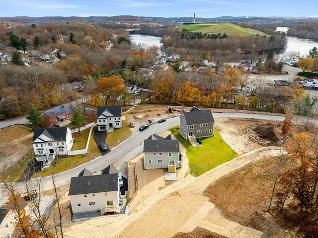 an aerial view of a house with a swimming pool