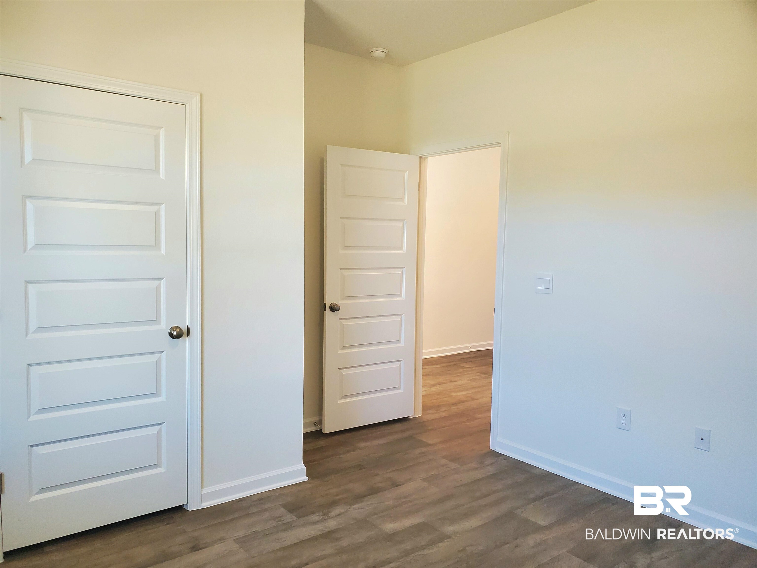 14666 Dayton Circle Foley, AL 36535 - Photo 4 of 21 Unfurnished room with dark wood-type flooring