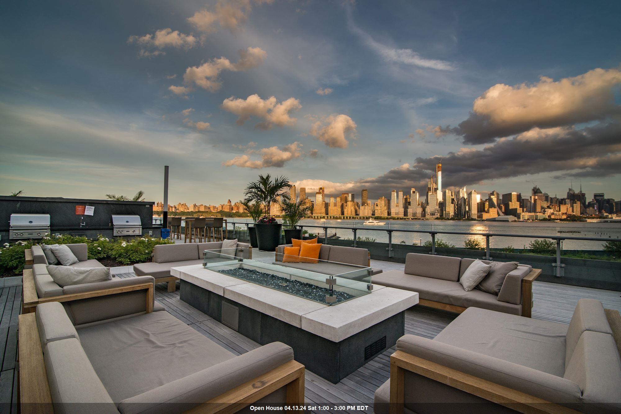 a outdoor living space with patio furniture and a city view