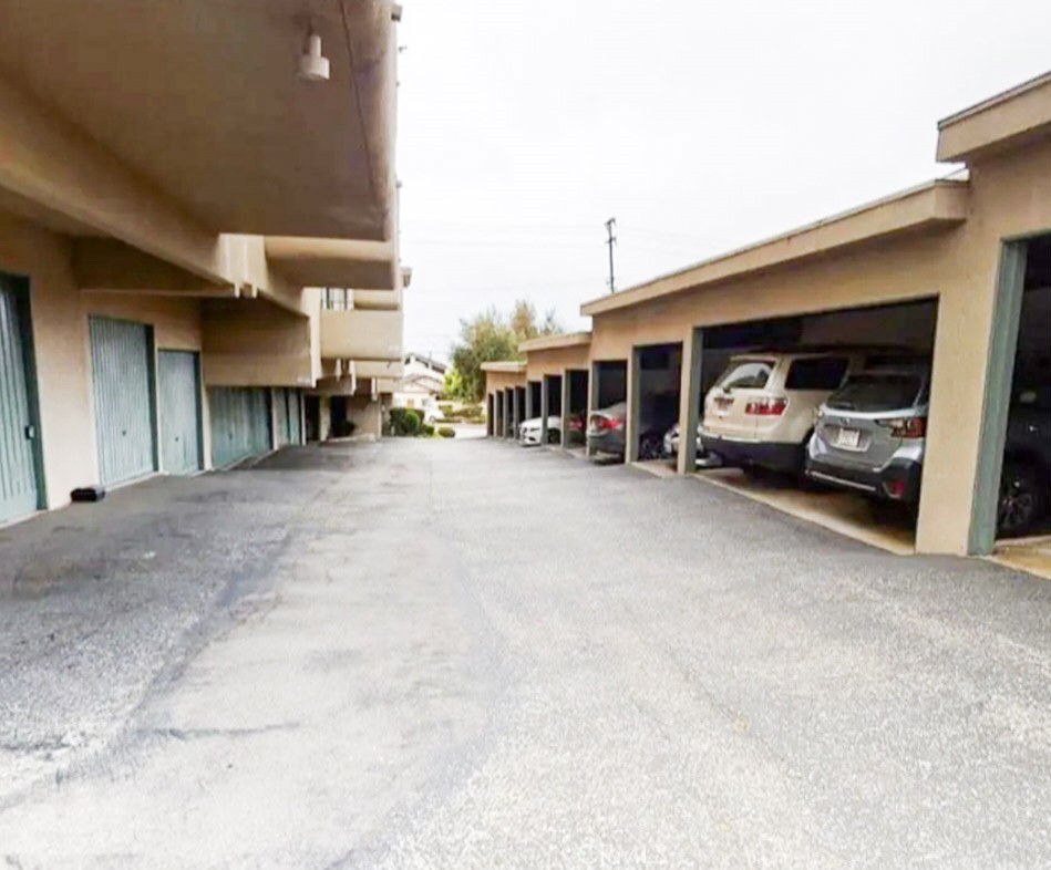 209 South Prospect Avenue, Unit 110 Redondo Beach, CA 90277 - Photo 11 of 11 a view of a cars park in front of house