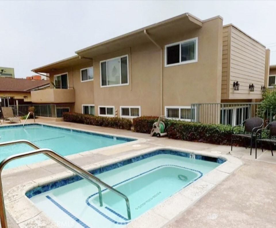 209 South Prospect Avenue, Unit 110 Redondo Beach, CA 90277 - Photo 3 of 11 a view of a house with a swimming pool