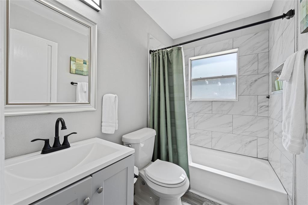 1900 North 6th Street Waco, TX 76708 - Photo 17 of 23 a bathroom with a sink toilet and shower