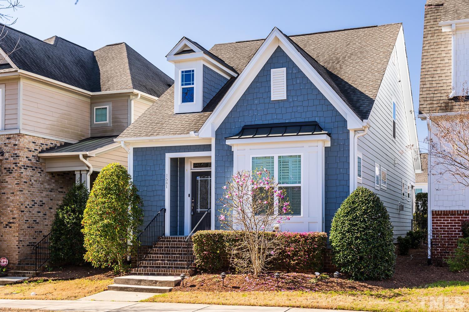 1581 Fullerton Place Raleigh, NC 27607 - Photo 1 of 42 a front view of a house with garden