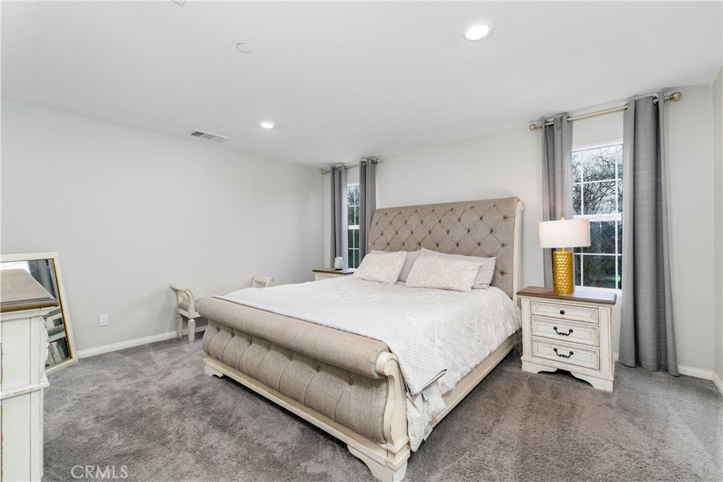 3682 Loheria Street Riverside, CA 92503 - Photo 13 of 37 a bedroom with a bed and a cabinets