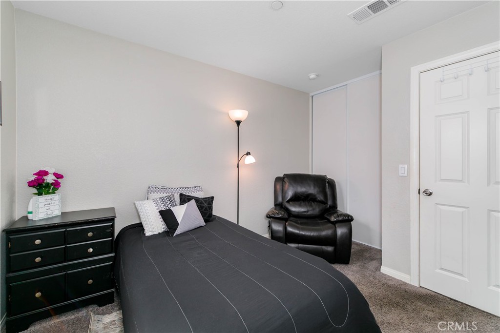 3682 Loheria Street Riverside, CA 92503 - Photo 18 of 37 a bedroom with a bed and a dresser