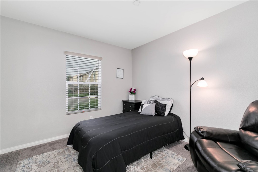 3682 Loheria Street Riverside, CA 92503 - Photo 19 of 37 a bedroom with a bed and a window