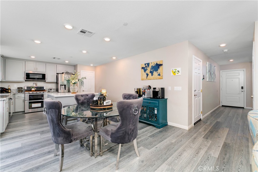 3682 Loheria Street Riverside, CA 92503 - Photo 2 of 37 a view of a dining room with furniture and wooden floor