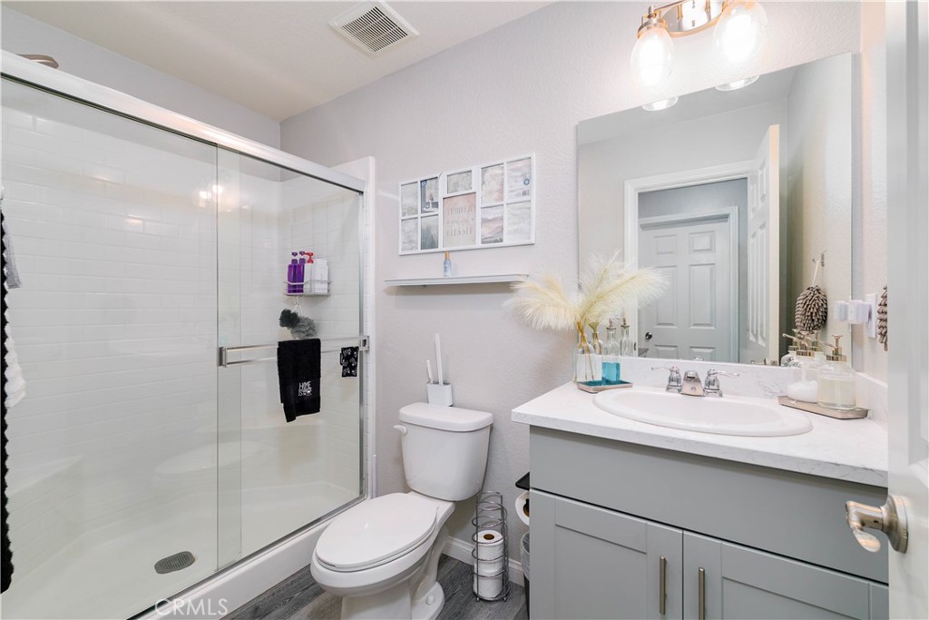 3682 Loheria Street Riverside, CA 92503 - Photo 21 of 37 a bathroom with a sink toilet and shower