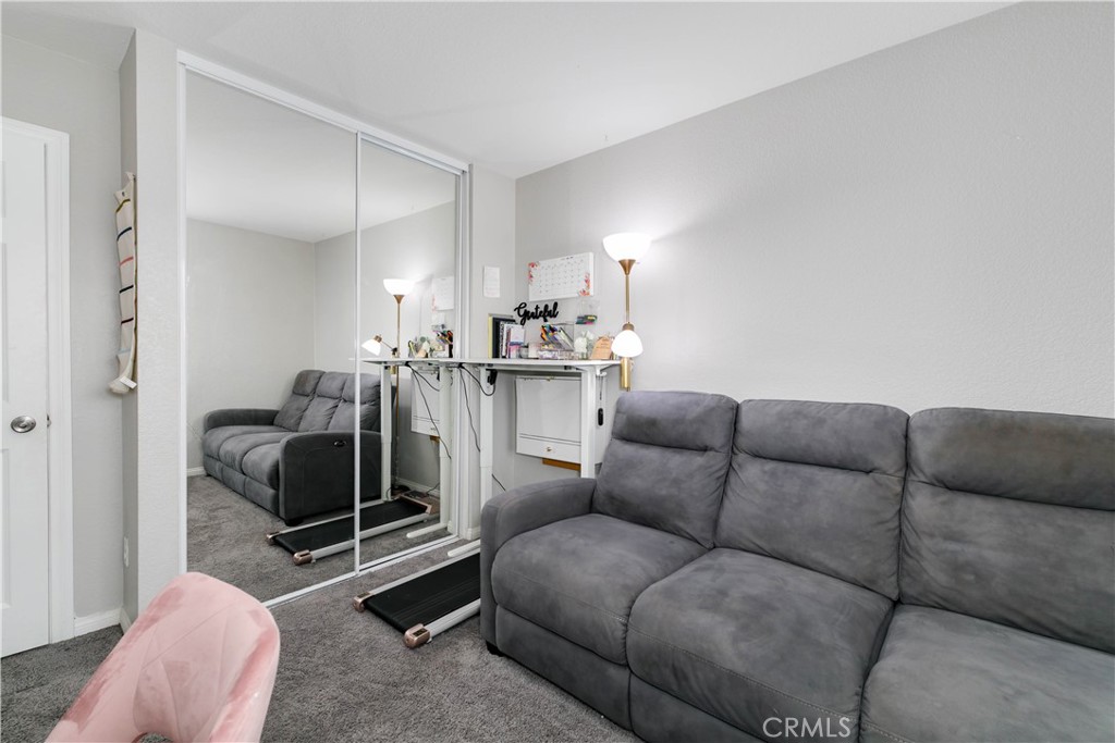 3682 Loheria Street Riverside, CA 92503 - Photo 23 of 37 a living room with furniture and a couch