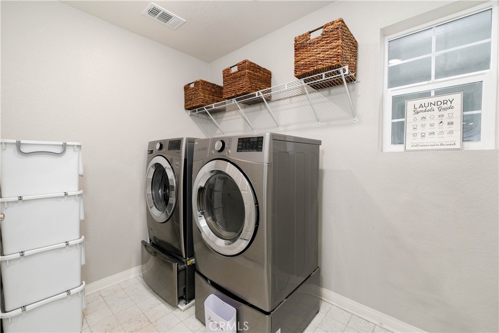 3682 Loheria Street Riverside, CA 92503 - Photo 28 of 37 a utility room with dryer and washer