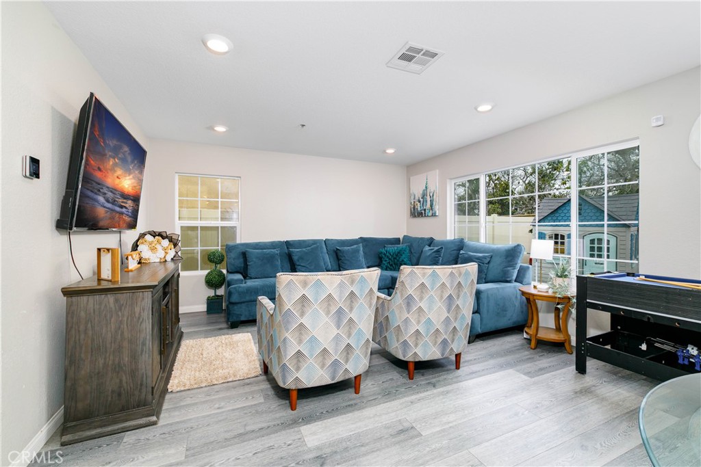 3682 Loheria Street Riverside, CA 92503 - Photo 6 of 37 a living room with furniture and a flat screen tv