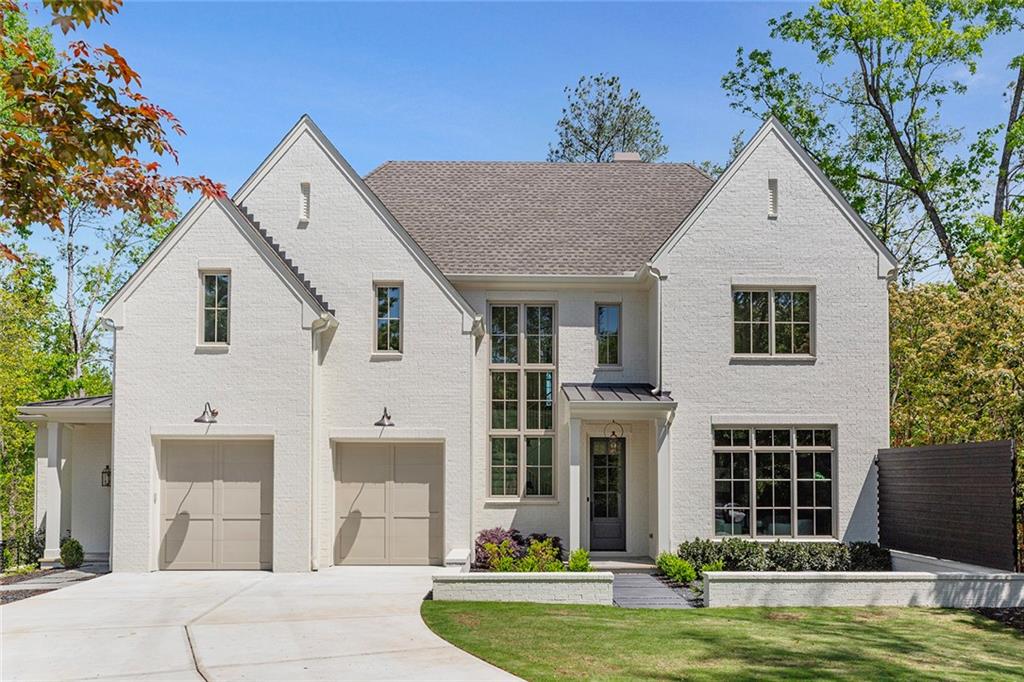 a front view of house with yard and swimming pool
