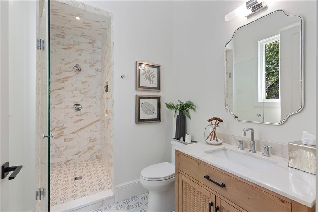 3290 Dunlop Court Atlanta, GA 30319 - Photo 12 of 81 a bathroom with a granite countertop sink toilet and shower