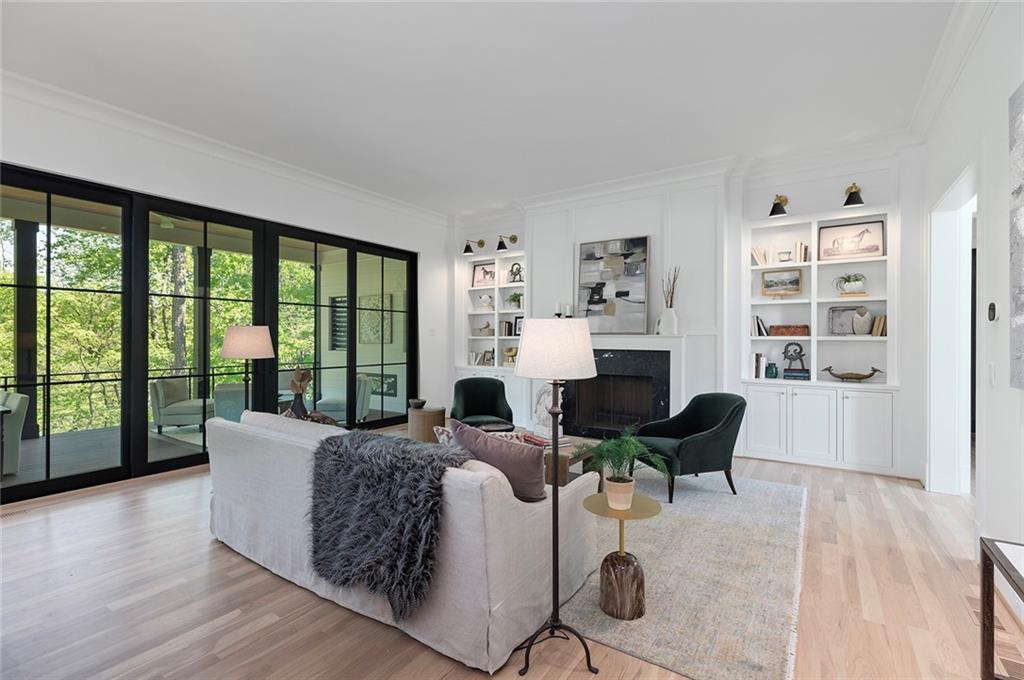 3290 Dunlop Court Atlanta, GA 30319 - Photo 14 of 81 a living room with fireplace furniture and a large window