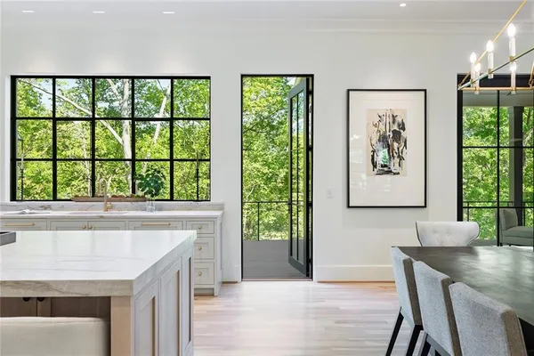 a kitchen with granite countertop a sink and a stove top oven