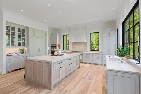 a bathroom with a sink vanity granite and a mirror