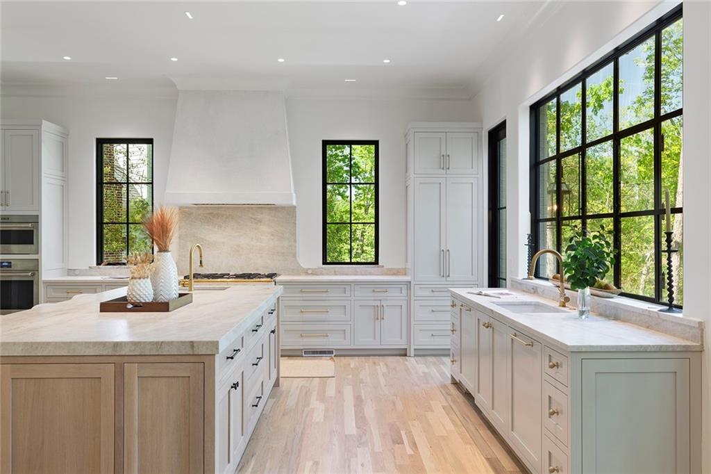 3290 Dunlop Court Atlanta, GA 30319 - Photo 23 of 81 a bathroom with a granite countertop sink and a large window